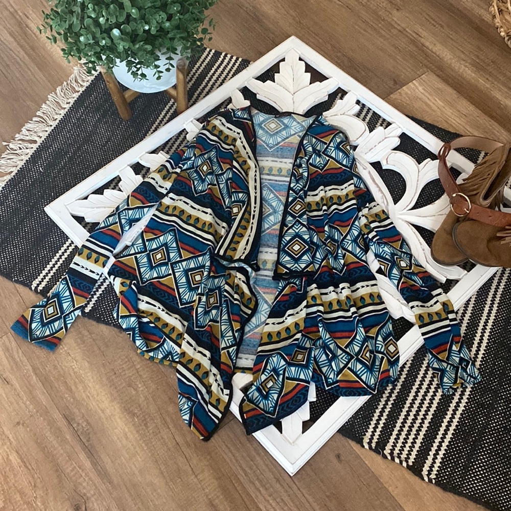 Cute tapered cardigan with colorful pattern. Size large.